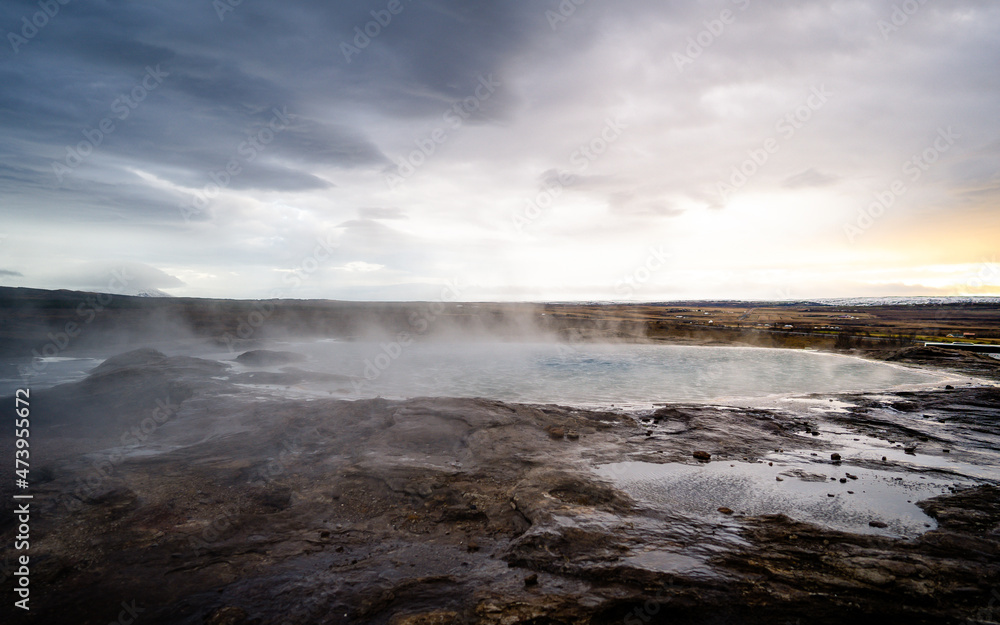 Impressive view of Icelands Geysir Geisir in the Golden Circule, the geothermal activity and a attraction for tourists in Iceland