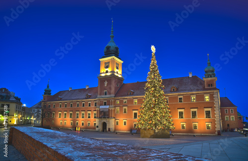 Royal Castle and Christmas tree at daybreak in the Warsaw Old Town. Poland