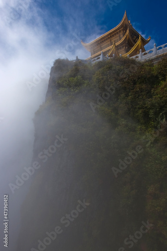 China, Sichuan, Emeishan City, Fog shrouding Buddhist temple at summit of Mount Emei photo