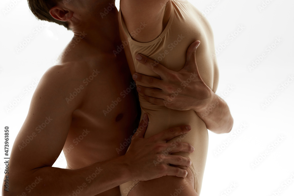 Partial image of couple dancing classical ballet