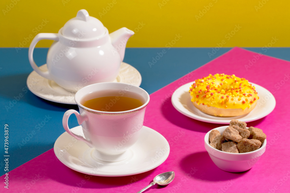 Tea with dessert on a bright colored background Tea with dessert on a bright colored background