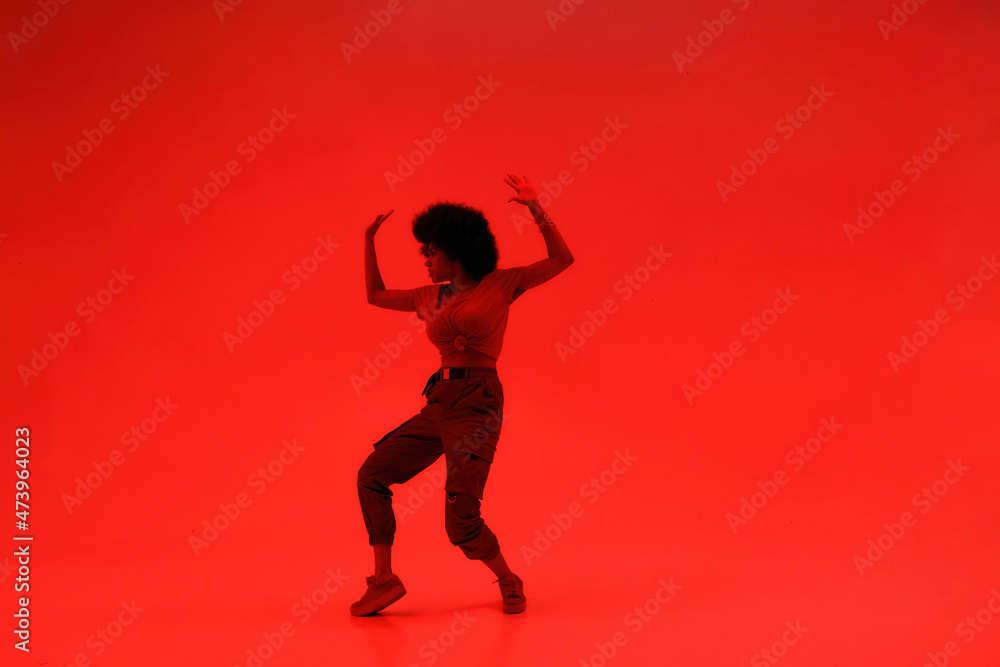Young cool female dancer dancing hip hop dance