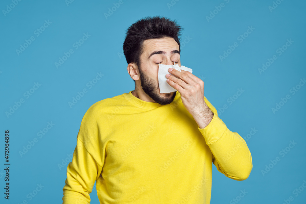man in yellow sweater health problems emotions blue background man in yellow sweater health problems emotions blue background