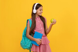 september 1. healthy childhood. child with school bag. music. cheerful teen girl carry backpack.