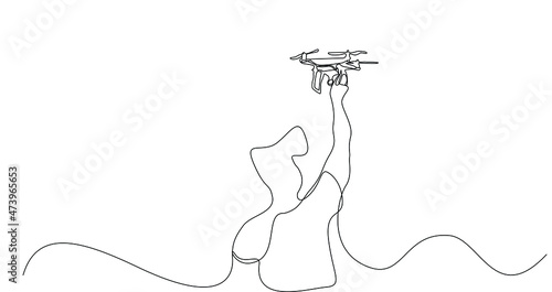 Young man using drone is controlling. Photographer taking images with drone.