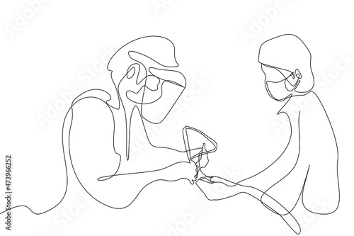 a doctor performing the surgery and the other doctors and nurses assisting her in the operation