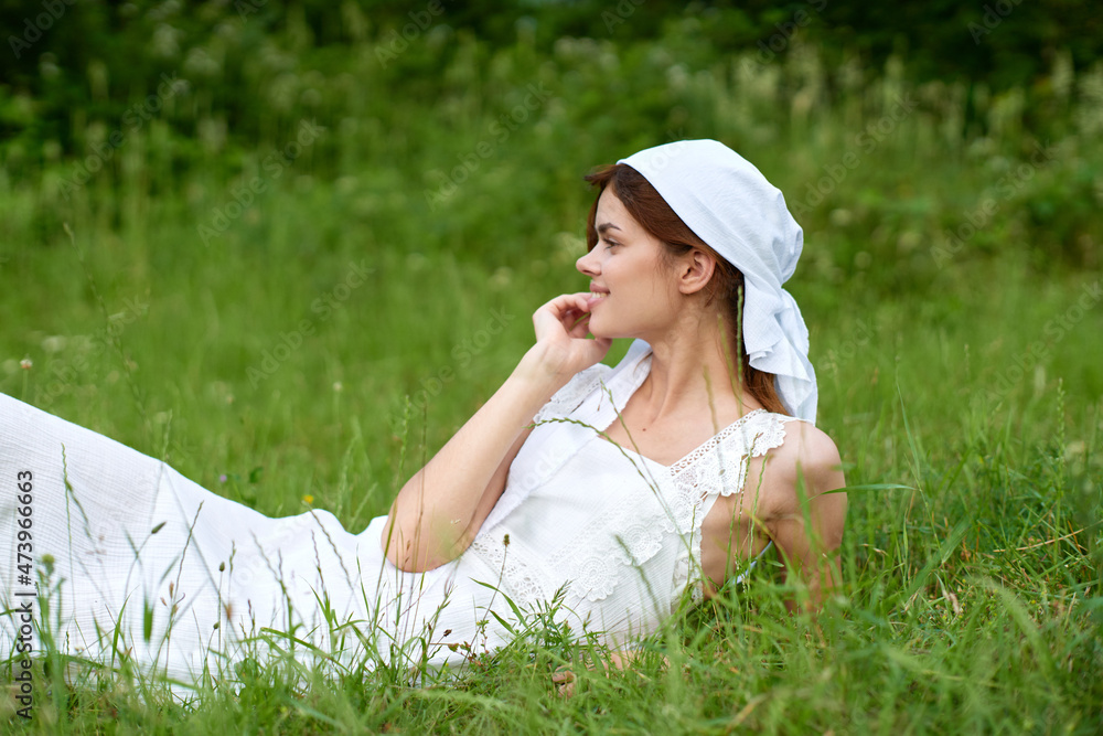 Woman in white dress in the village outdoors Green grass Farmer Woman in white dress in the village outdoors Green grass Farmer