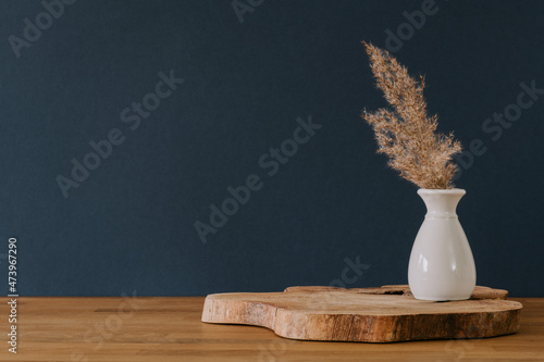 Decoration in vase on navy background with copy space photo