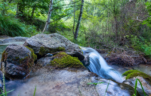 Water flowing at summer photo