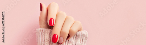 Bilde på lerret Manicured womans hand in sweater