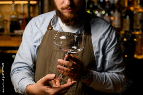 wonderful empty wine goblet glass in male hands