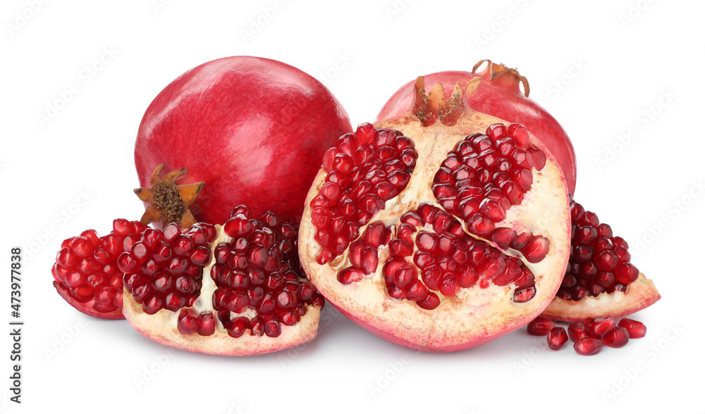 Tasty ripe pomegranates with juicy seeds on white background Tasty ripe pomegranates with juicy seeds on white background