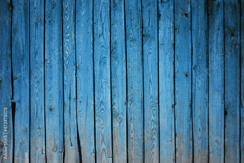 wooden wall, blue background © vlntn