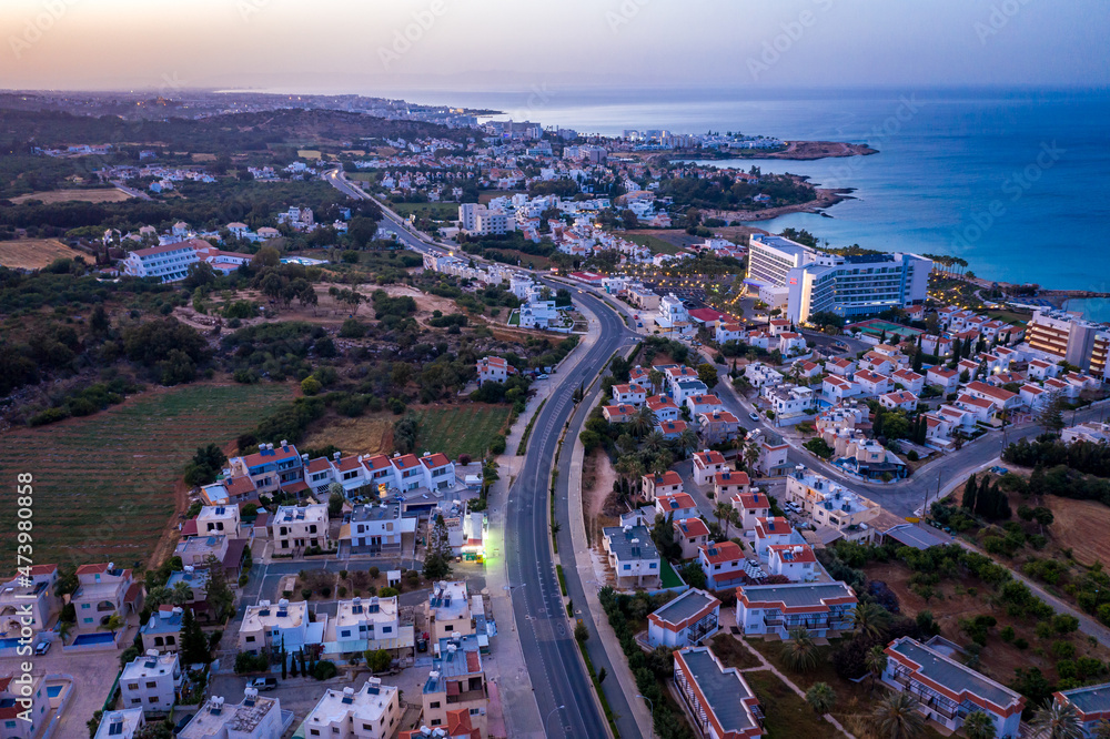 Obraz premium Panoramic view from above to Protaras. Evening landscape in Cyprus. Hotels and tourist infrastructure in Cyprus. Cape Capo Greco