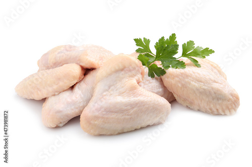 Raw chicken wings with parsley on white background