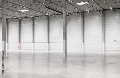 Clean and empty industrial hall in detail for supporting poles