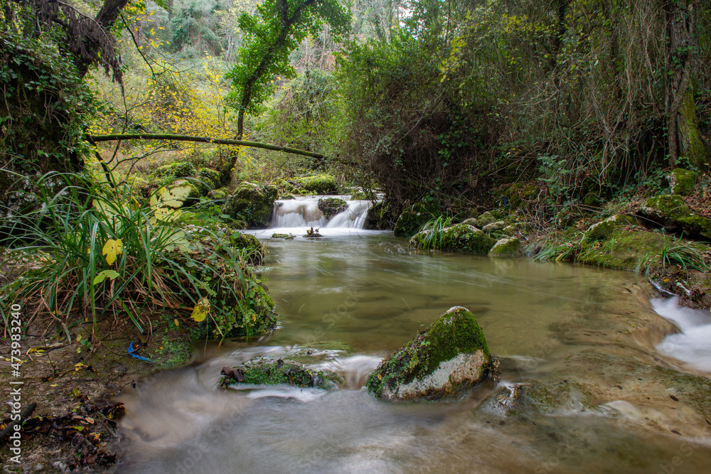 Beautiful river and small waterfall in the forest in valanio village corfu greece Beautiful river and small waterfall in the forest in valanio village corfu greece