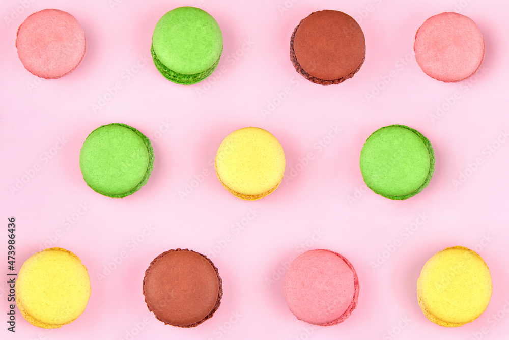 Bright multicolored cookies on a pink background. Bright multicolored cookies on a pink background.