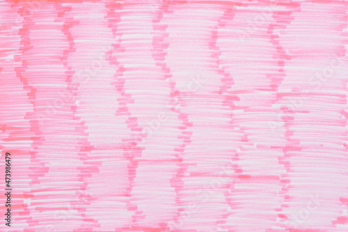 
Permanent pink marker doodles pattern texture brushes on white background. Closeup of red marker doodles on pink paper background.