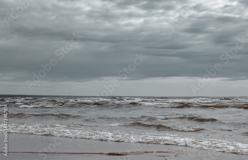 Atmospheric scenery Dramatic Baltic sea, waves and water splashes on breakwaters