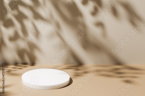 Abstract minimal nature scene - empty stage and white circle podium on beige background and soft shadows of tree leaves. Pedestal for cosmetic product and packaging mockups display presentation photo