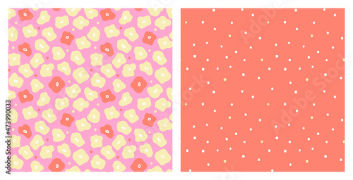 Floral and coordinating polka dot colorful non directional seamless pattern set for summer clothing or home decor fabric print. Abstract hand drawn flowers in pink, orange and yellow bright happy colo