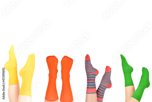 Yellow socks on woman foot isolated on white background.