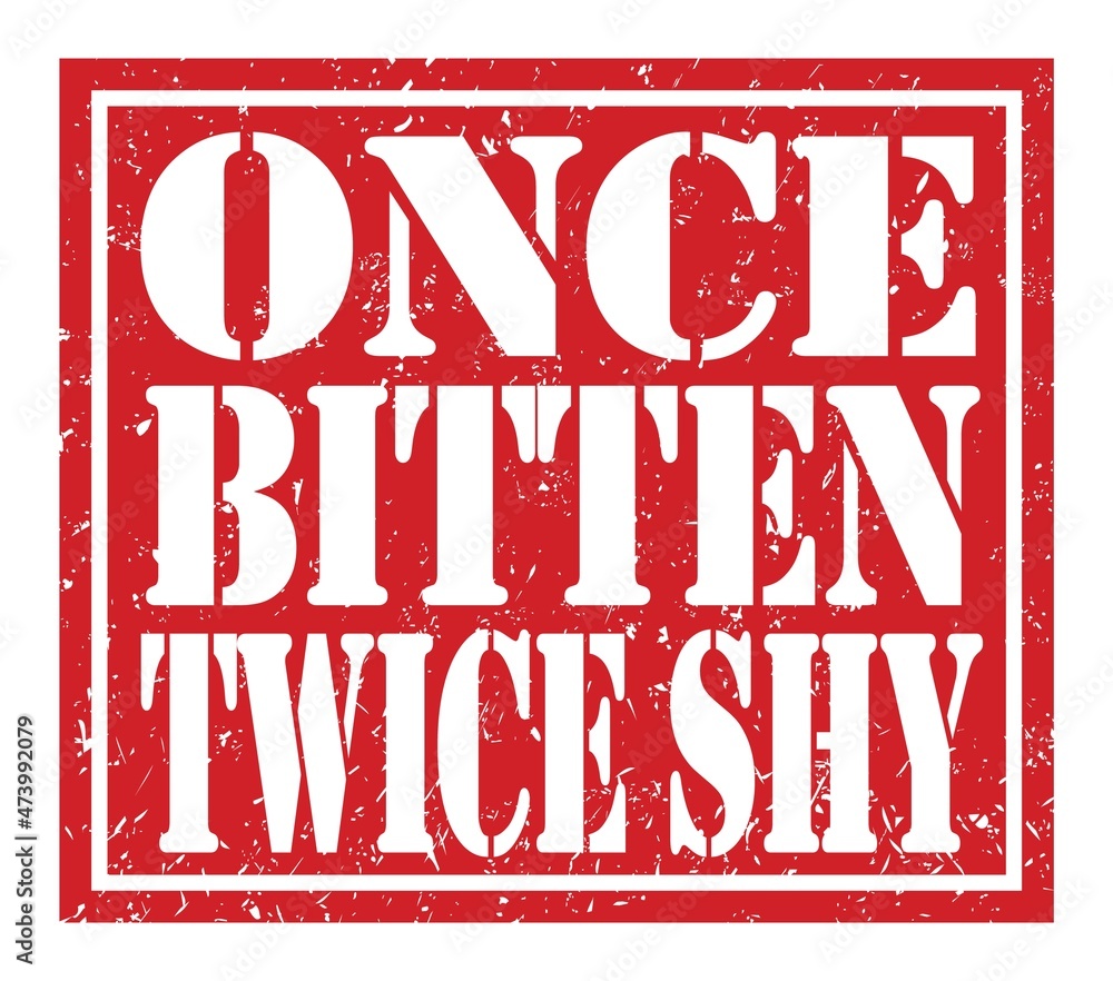 ONCE BITTEN TWICE SHY, text written on red stamp sign ONCE BITTEN TWICE SHY, text written on red stamp sign