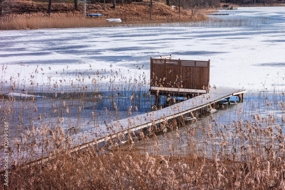 Jetty in a frozen lake Jetty in a frozen lake