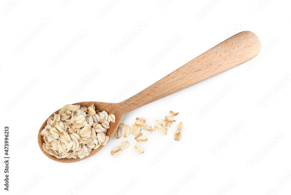 Raw oatmeal and wooden spoon on white background, top view Raw oatmeal and wooden spoon on white background, top view