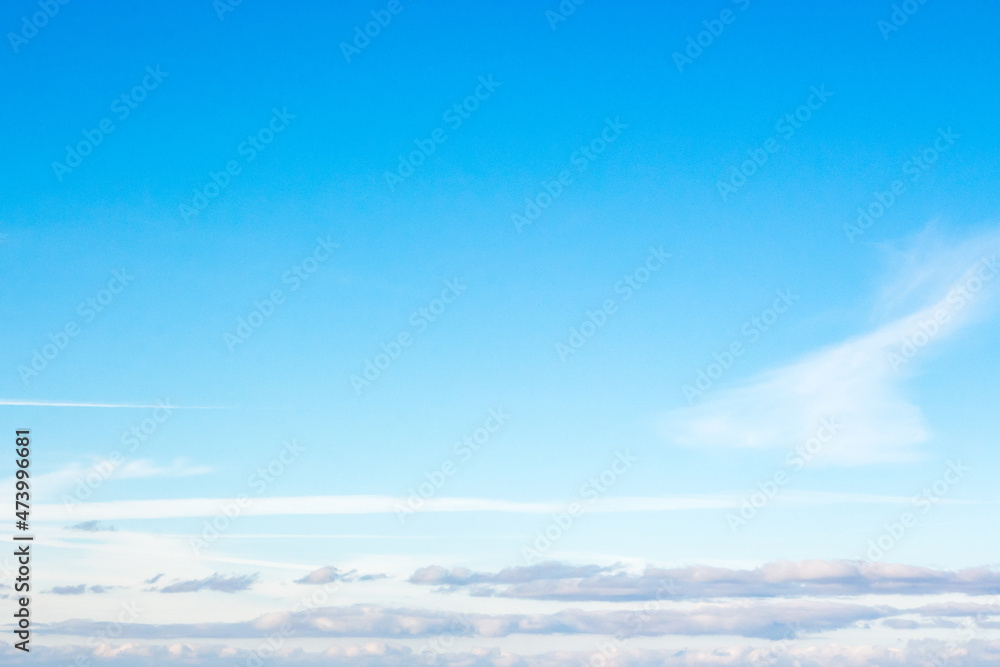 Fototapeta premium white fluffy clouds on a deep blue sky. sunny weather conditions