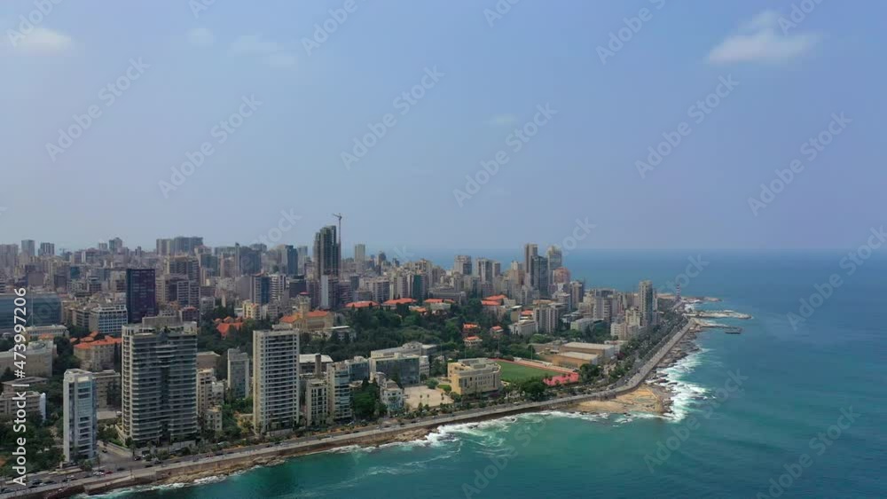 Aerial Panning Beautiful Shot Of Tall Buildings Against Sky, Drone Flying Over Sea In City - Beirut, Lebanon Aerial Panning Beautiful Shot Of Tall Buildings Against Sky, Drone Flying Over Sea In City - Beirut, Lebanon