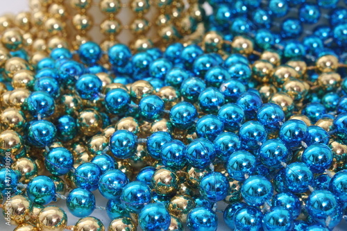Blue and Gold Holiday Bead Decortations. Christmas Background