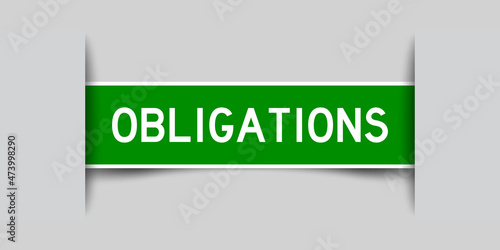 Inserted green color label sticker with word obligations on gray background