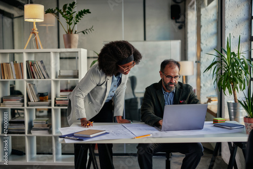 Photography Diverse business couple having a discussion in an office