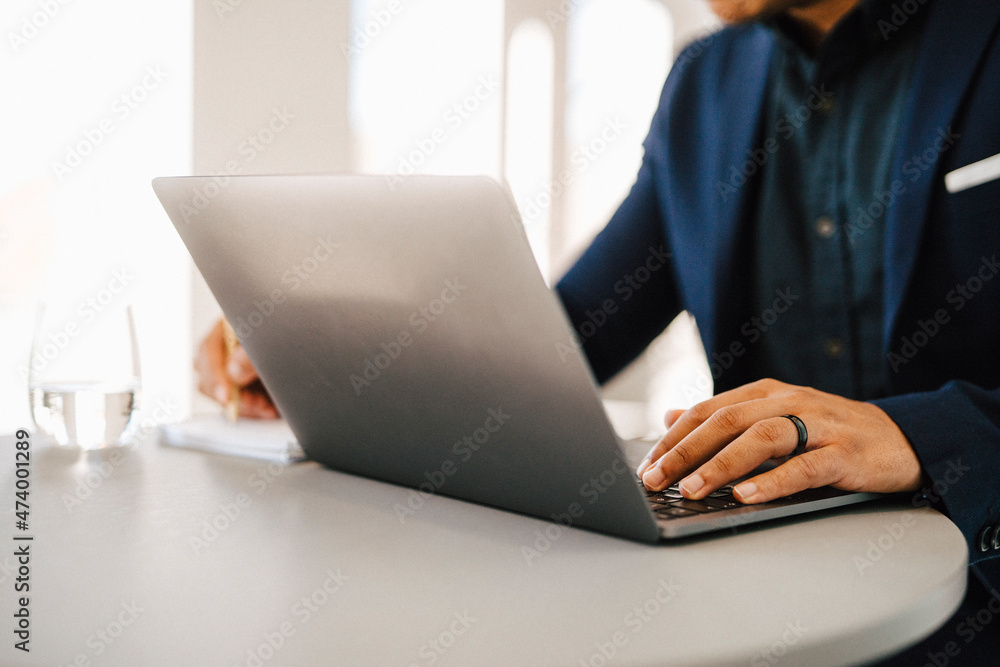 Man's hands on laptop keyboard Man's hands on laptop keyboard