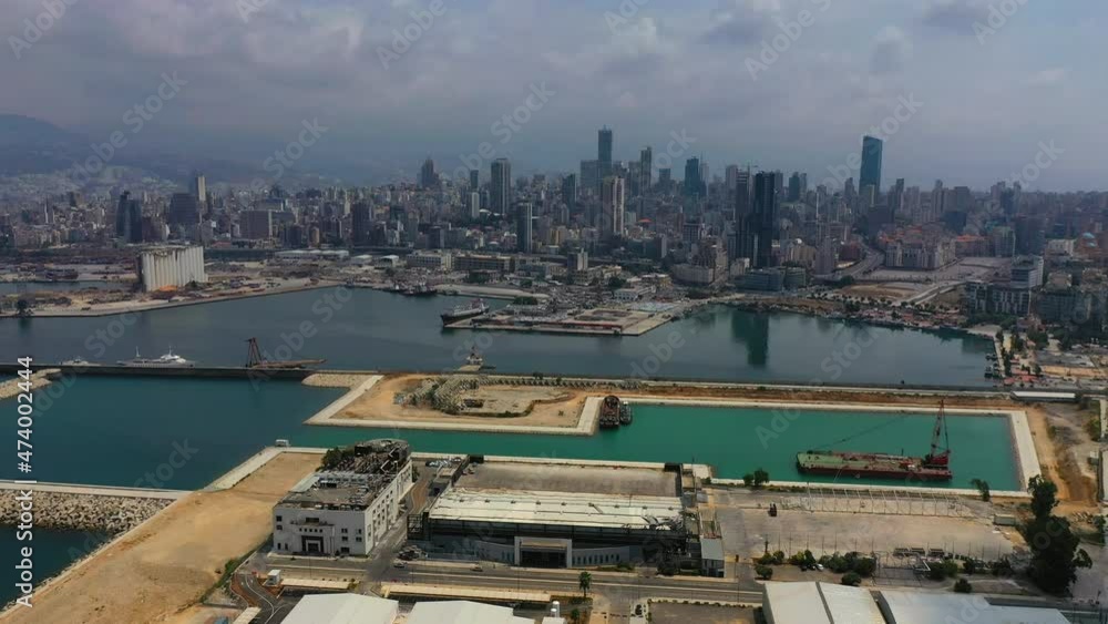 Aerial Beautiful Shot Of Buildings Against Cloudy Sky, Drone Flying Backwards Over Port - Beirut, Lebanon Aerial Beautiful Shot Of Buildings Against Cloudy Sky, Drone Flying Backwards Over Port - Beirut, Lebanon
