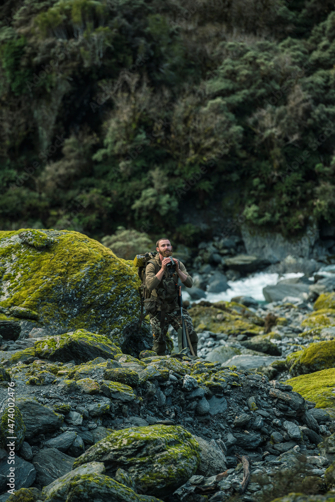 Man looking through binoculars