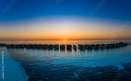 Maldives, South Male Atoll, Aerial view of lagoon of the Maldives island of Maadhoo at sunset photo