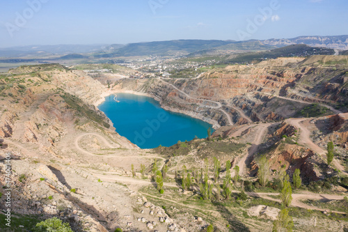 Aerial view of Heart shaped blue quarry lake. Kadykovsky quarry, Balaklava, Crimea.