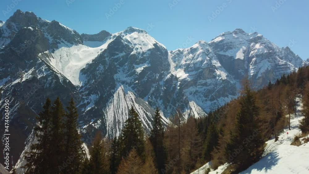 Snow covered mountains in the Pinnis Valley in Austria, camera panning Snow covered mountains in the Pinnis Valley in Austria, camera panning