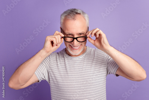 Photo of cheerful man good mood hands touch eyeglasses wear casual clothes isolated over violet color background