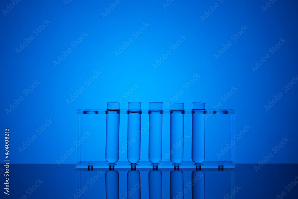 Test tubes with liquid on blue background, closeup. Laboratory analysis. Research lab glassware equipment. Science experiment in laboratory. Test tubes with liquid on blue background, closeup. Laboratory analysis. Research lab glassware equipment. Science experiment in laboratory.