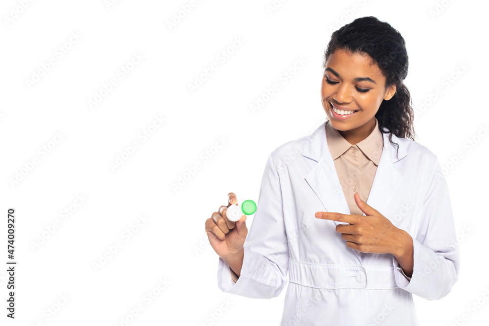 Positive african american doctor pointing with finger at contact lenses isolated on white. Positive african american doctor pointing with finger at contact lenses isolated on white.