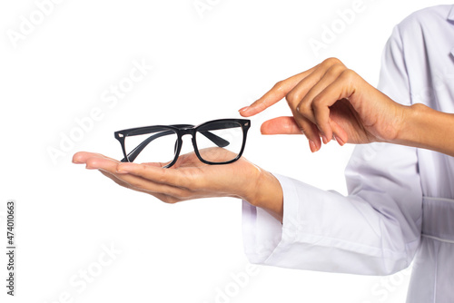 Cropped view of african american oculist holding eyeglasses isolated on white.
