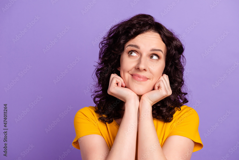 Photo of young charming lady hands touch chin curious wondered look empty space isolated over violet color background Photo of young charming lady hands touch chin curious wondered look empty space isolated over violet color background