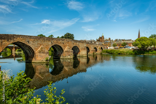 The Medieval Devorgilla Bridge, reflecting on the River Nith photo