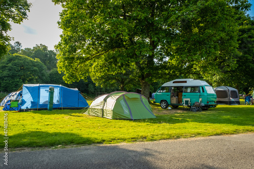 Fototapeta Naklejka Na Ścianę i Meble -  Camper vans and tents pitched at a camp site during the summer