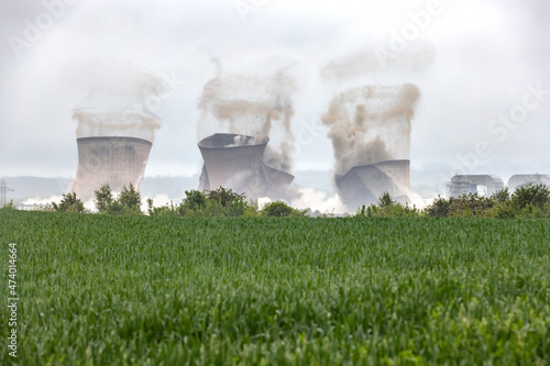 UK, England, Rugeley, Cooling towers falling down during demolishing process photo