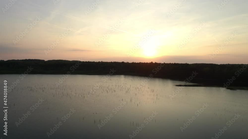 Beautiful View of Scenic lake with water reflection, surrounded by Forest and trees at Sunset. Aerial Drone Shot. Taken near Beerse, Belgium. 4K. High quality 4k footage Beautiful View of Scenic lake with water reflection, surrounded by Forest and trees at Sunset. Aerial Drone Shot. Taken near Beerse, Belgium. 4K. High quality 4k footage